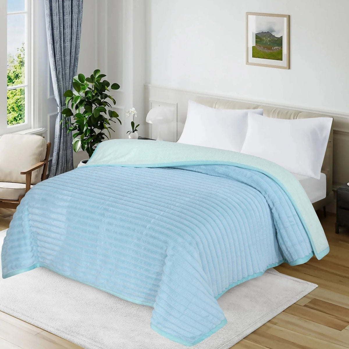 Light blue ribbed textured blanket on a white bed in a bright bedroom