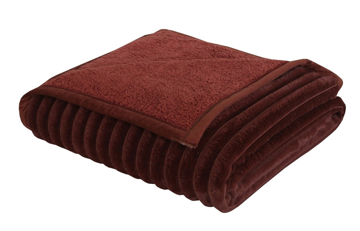 Folded premium burgundy plush fleece blanket with ribbed texture