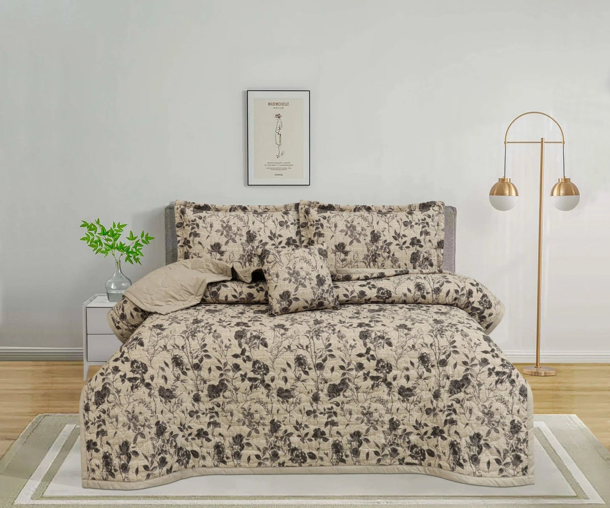 Beige floral print bedspread set with matching pillows in a modern bedroom